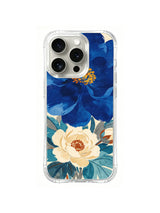 Sapphire Ivory Bloom Pair: A deep blue flower and ivory bloom overlap above teal foliage.