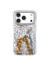 Cream paper bird guiding a blue deer beside a terracotta book arch on an iPhone 17 Pro case