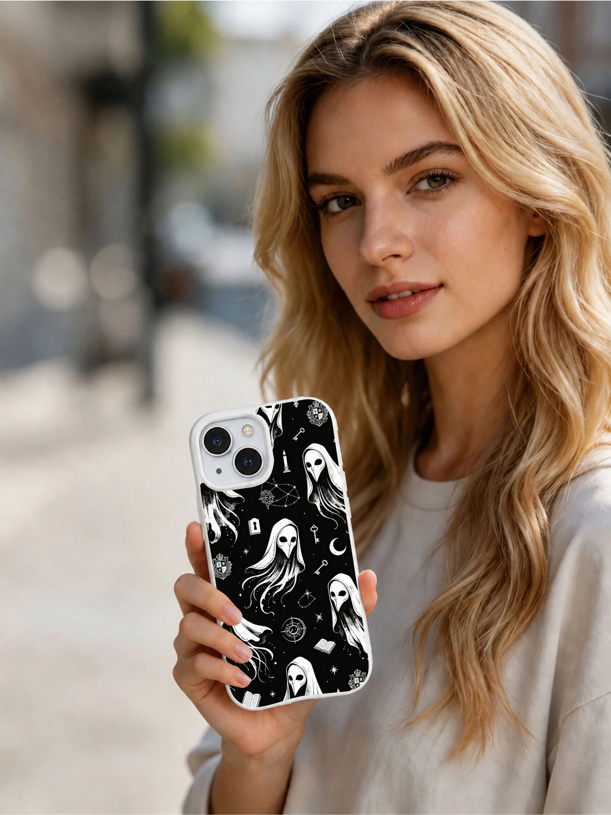 Person holding Vesper Wraith scholarly apparition iPhone 15 Plus case