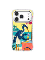 Seaside heron presenting a balanced three-scoop cone beside a coral cart on an iPhone 17 Pro case