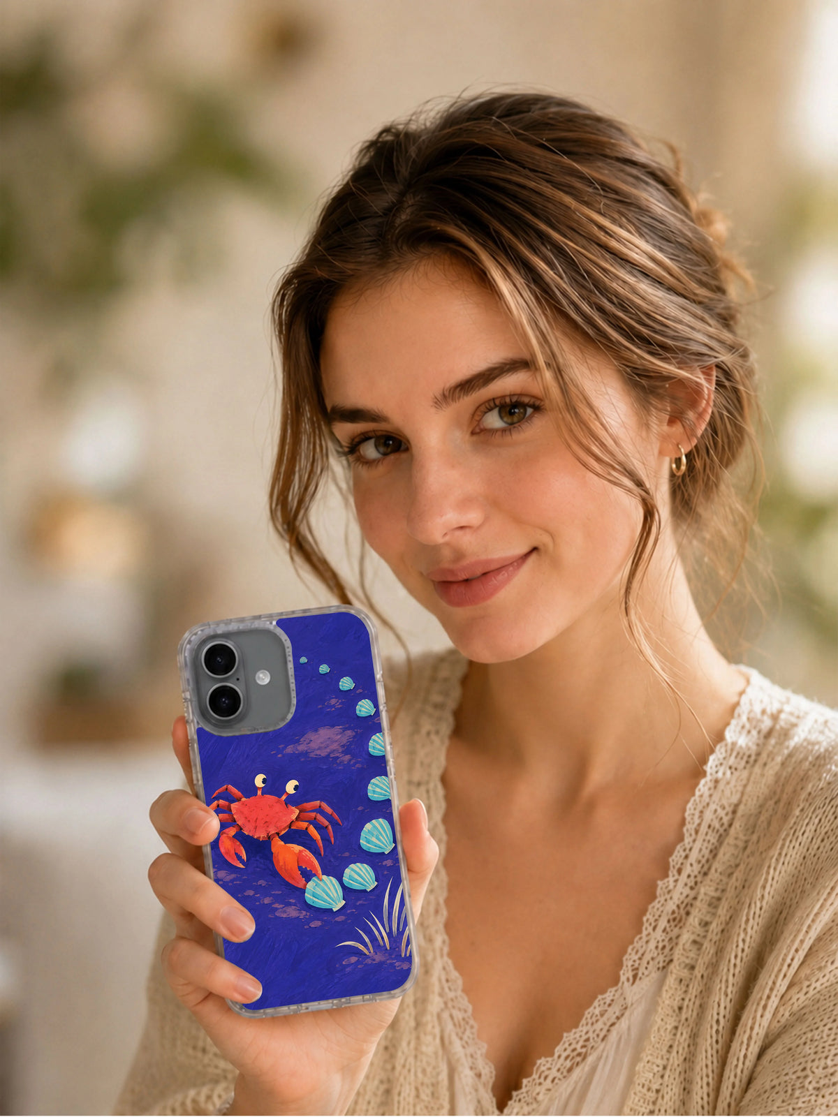 Lifestyle portrait holding the Sideways Is a Direction crab art iPhone 17 case