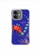 Coral crab and turquoise shells forming a low horseshoe curve on a blue-violet phone case