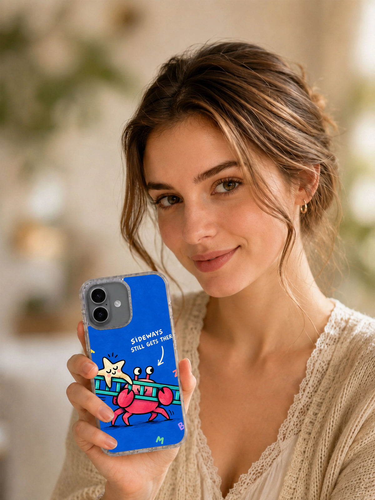 Sideways Still Gets There pink crab iPhone 16 case in a styled lifestyle scene