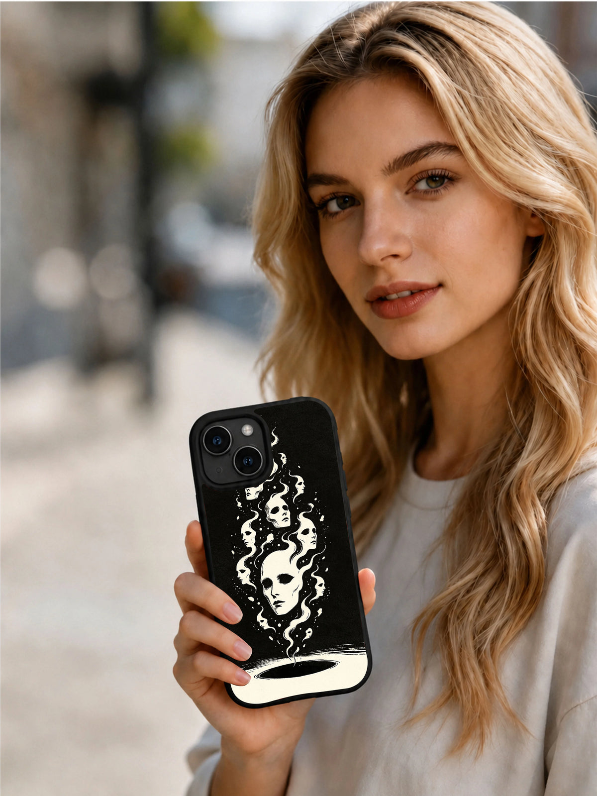 Person holding the Silent Shadow Faces black art iPhone 15 Plus case