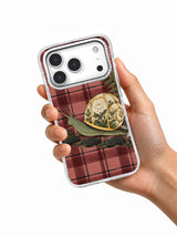 A Greenhouse at Snail’s Pace iPhone 17 Pro case held in hand