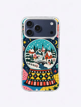 Winter River Snow Globe artwork on an iPhone case with red cottages, curved river, bridge, evergreen trees, and turquoise sky