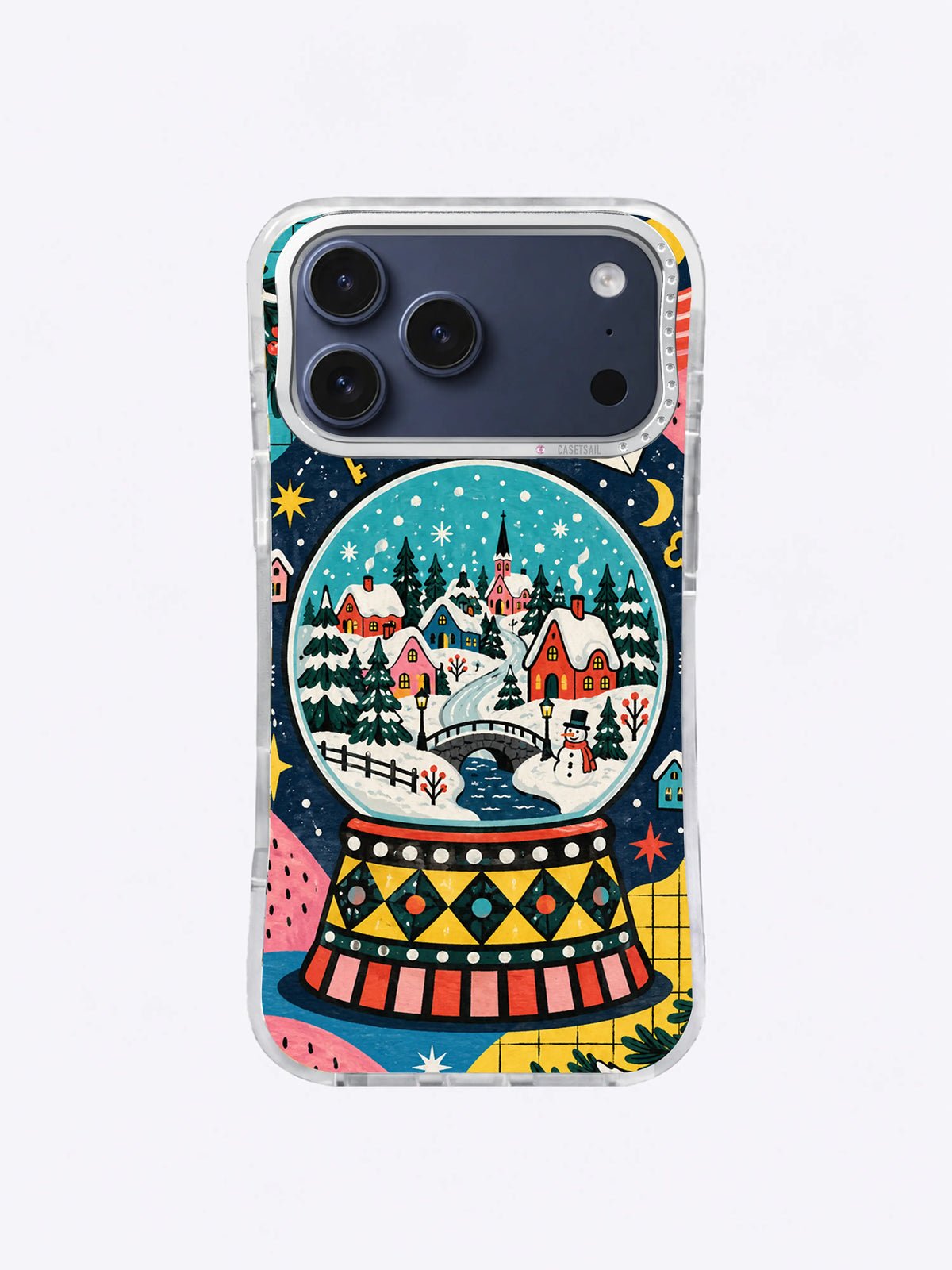 Winter River Snow Globe artwork on an iPhone case with red cottages, curved river, bridge, evergreen trees, and turquoise sky