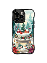 Holiday valley snow globe with ornaments on a black iPhone 16 Pro case