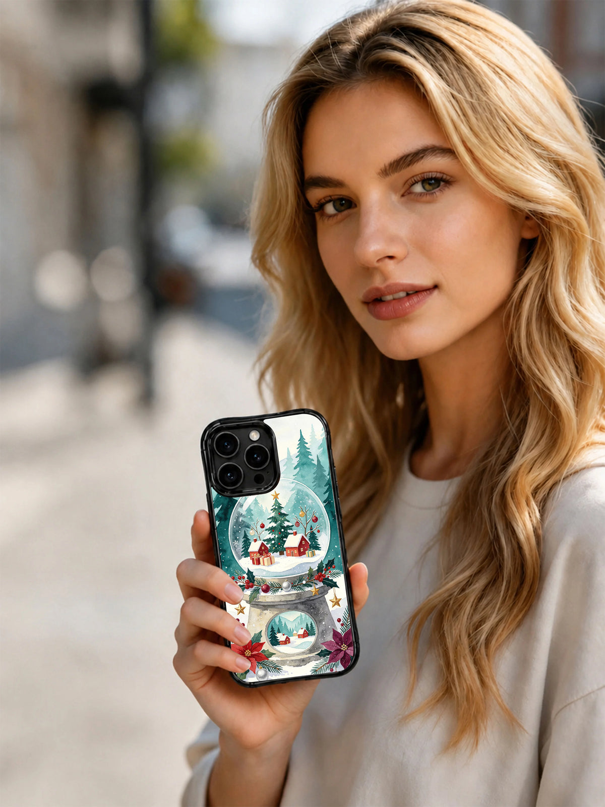 Lifestyle view of a Snow Globe Valley iPhone 16 Pro case