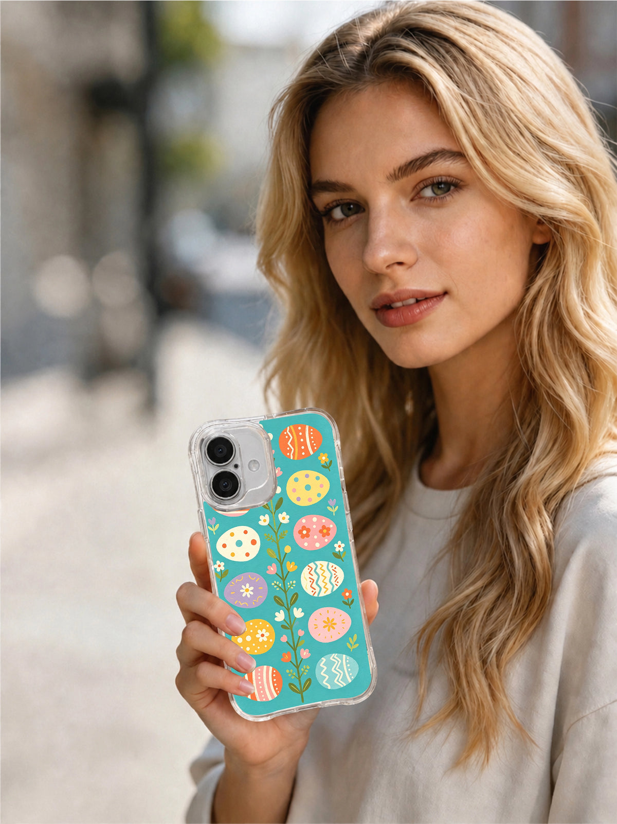 Spring Candy Eggs: Person holding the illustrated case in an outdoor portrait.