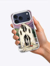 Hand holding The Stag in the Ruined Chapel iPhone case