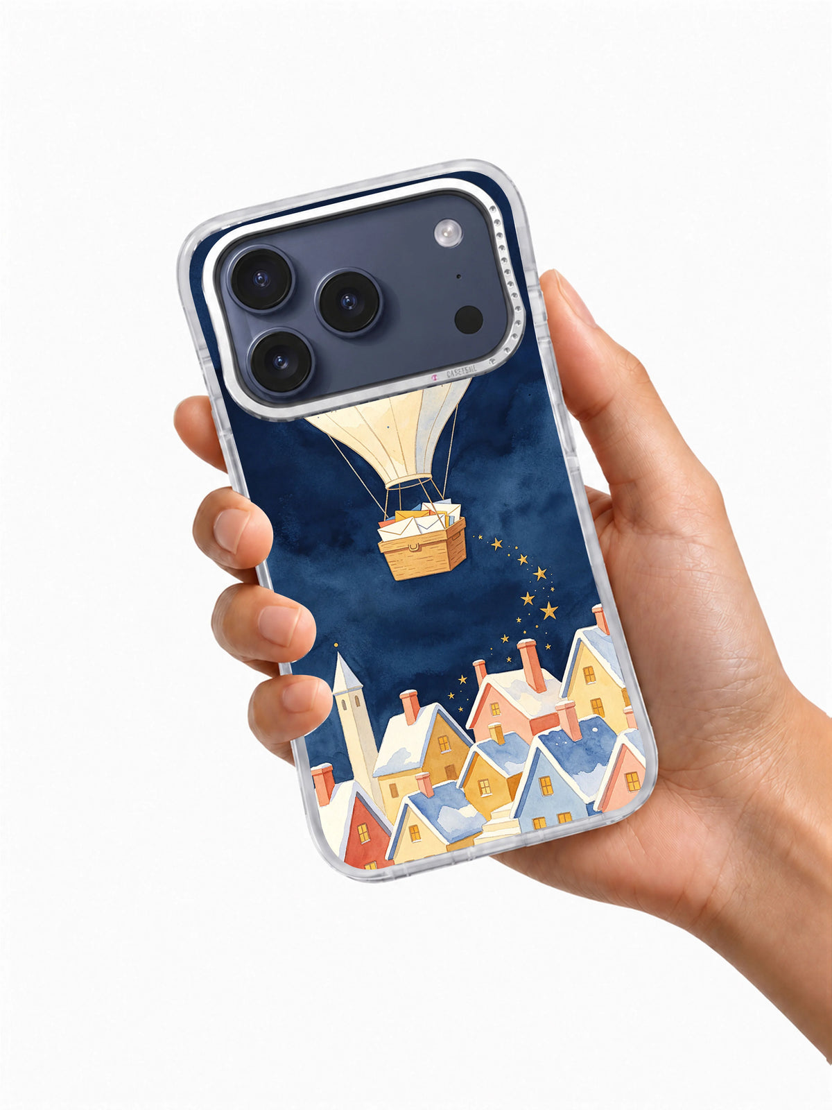 Handheld iPhone 17 Pro Max case showing the Star Post Balloon winter village artwork