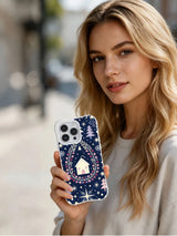 Lifestyle view of Starberry Cabin Night iPhone 13 Pro case with oval berry wreath and indigo cottage pattern