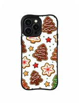 Starry Noel Cookies Christmas / Chocolate Tree Stars: Large brown cookie trees with red and yellow stars and pale flower-shaped biscuits.
