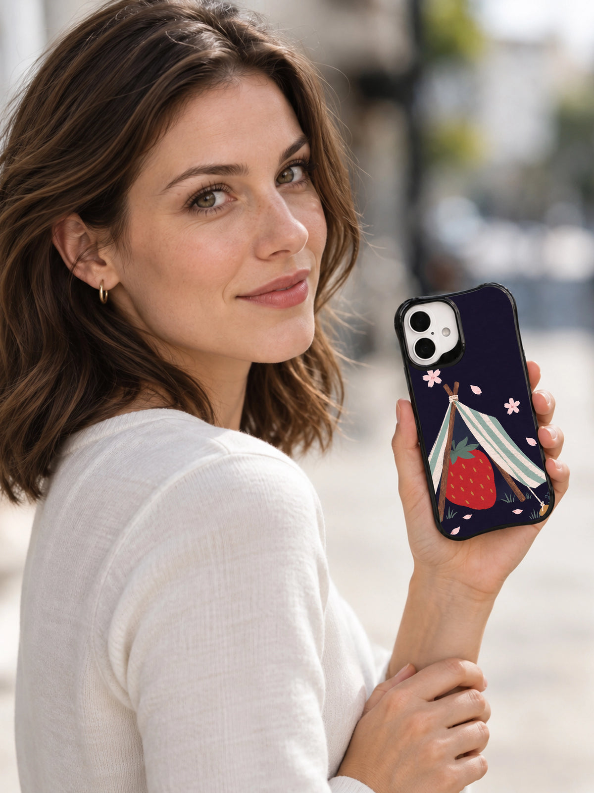 Strawberry Under Canvas iPhone 16 case lifestyle scene