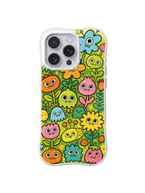 Meadow Bloom Buddies: Küçük renkli tek gözlü yaratıklar ve çiçekler parlak yeşil bahçeyi doldurur.