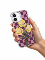 Sweet Peas Tie a Promise iPhone 17 case shown in hand