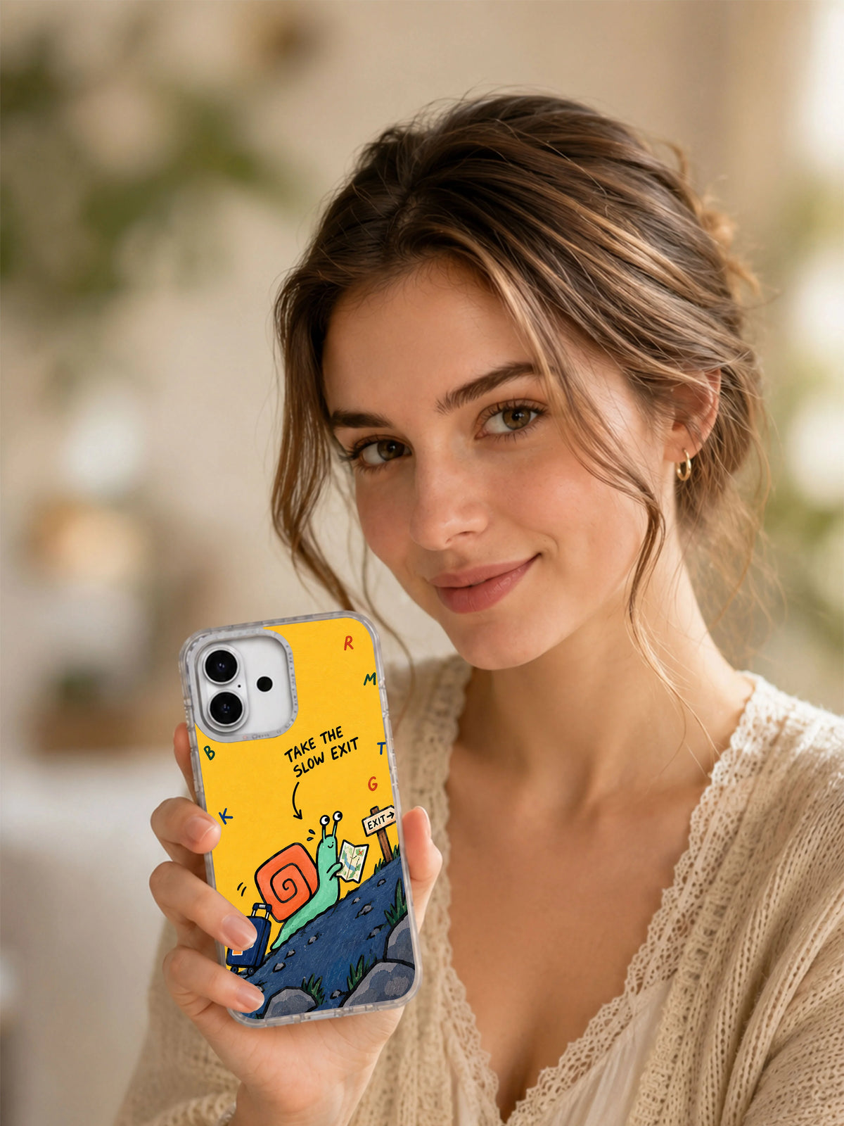 Lifestyle view of Take the Slow Exit illustrated iPhone 16 case with its mint snail artwork