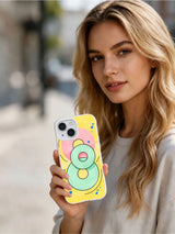 Sweet Orbit Lines artist-designed iPhone 15 case in hand