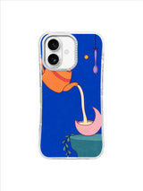 Moon tea scene with an apricot pot, pink crescent cup and hanging leafy vine on cobalt blue