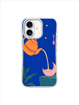 Apricot teapot pouring into a pale pink crescent cup beside teal leaves on a cobalt iPhone case