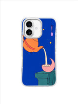 Orange teapot and crescent moon cup arranged over a quiet teal step on a cobalt iPhone case