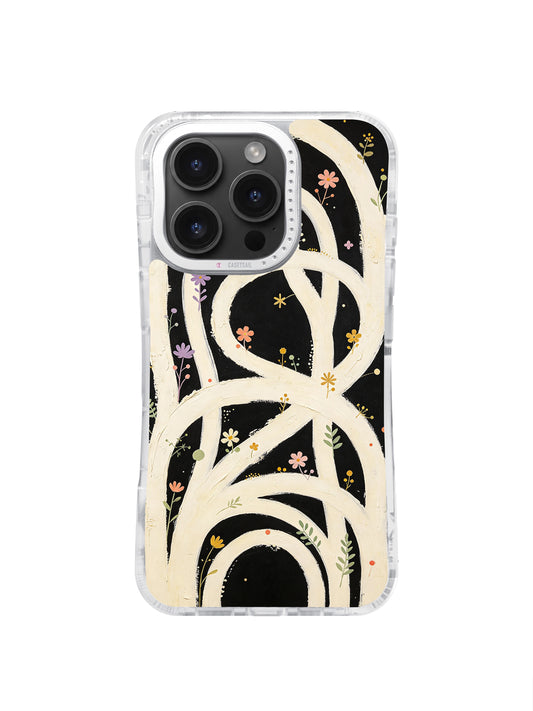 The Infinite Garden iPhone 16 Pro Max case with cream looping paths and colorful flowers on black