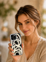 Woman presenting The Infinite Garden phone case