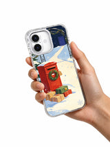 The Red Postbox in First Snow iPhone 17 case held in hand