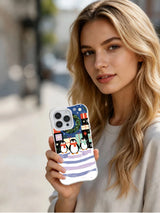 Lifestyle view of The Snow Choir clear-edge iPhone 15 Pro case held outdoors