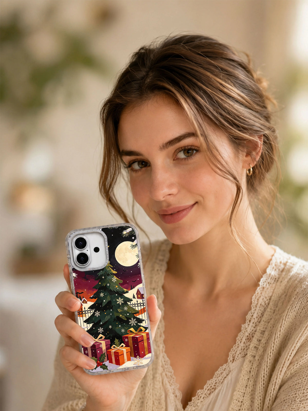 Woman holding The Star That Found Christmas Eve iPhone 17 case