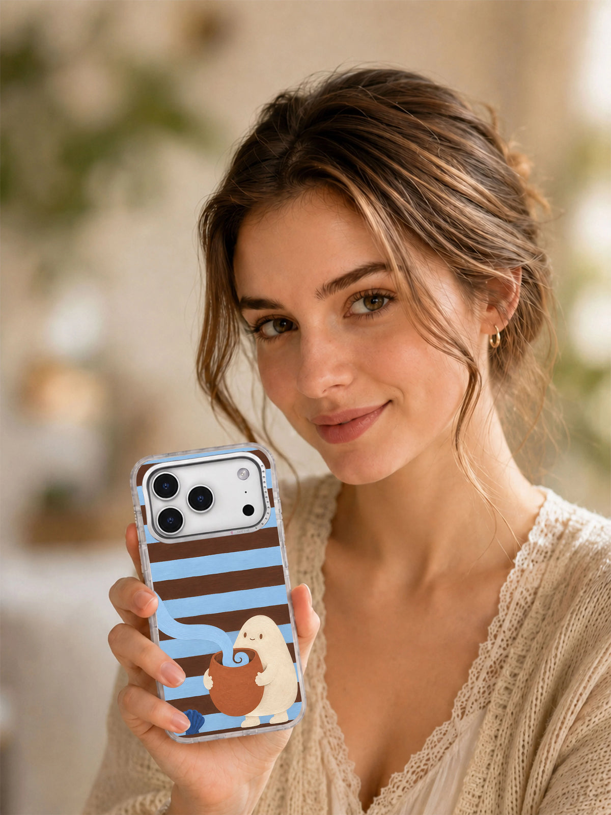 Lifestyle view of The Tide in a Teacup iPhone 17 Pro case