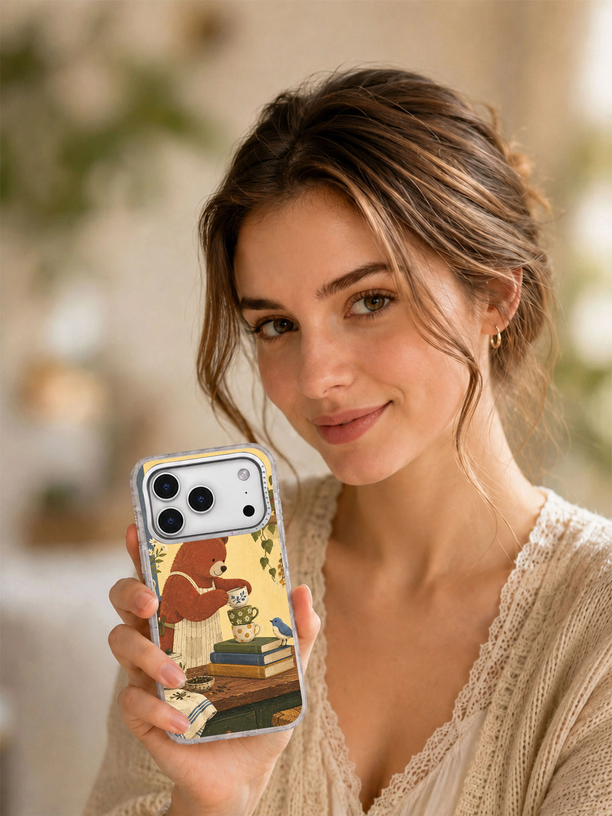 Lifestyle portrait holding the Three Cups Before Noon clear iPhone 17 Pro case