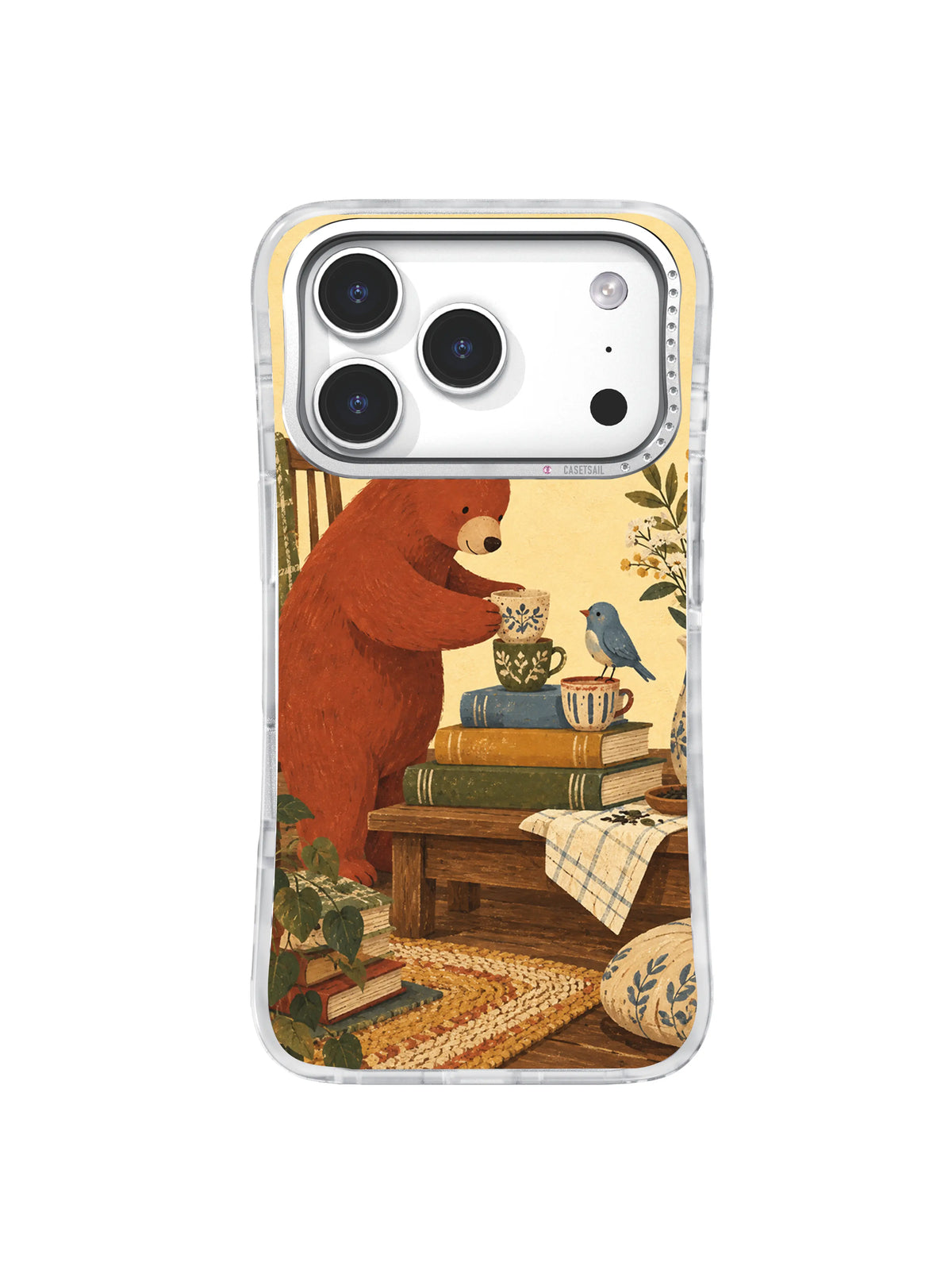 Bear setting a welcoming tea table with three different cups on an iPhone 17 Pro case