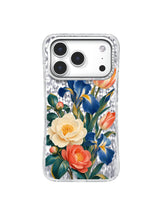 Cream, cobalt and coral flowers form an open botanical home on a transparent iPhone 17 Pro case