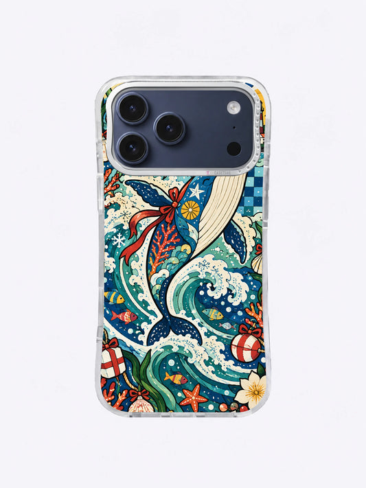 Tinsel Tail Gift Wave whale artwork on an iPhone 17 Pro Max case