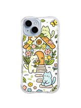 Flower Cottage Cat Friends: Krem, yeşil ve mavi kediler çiçekler ve yapraklarla çevrili küçük turuncu kulübenin yanında toplanır.