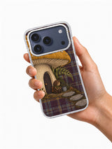The Toadstool Waiting Room iPhone 17 Pro case held in hand