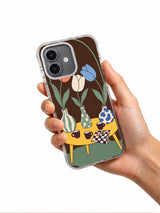 Tulips Hold a Secret Meeting iPhone 17 Case held in hand