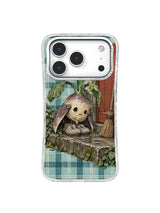 Ivory turnip guarding slippers by a back door iPhone 17 Pro case pattern one