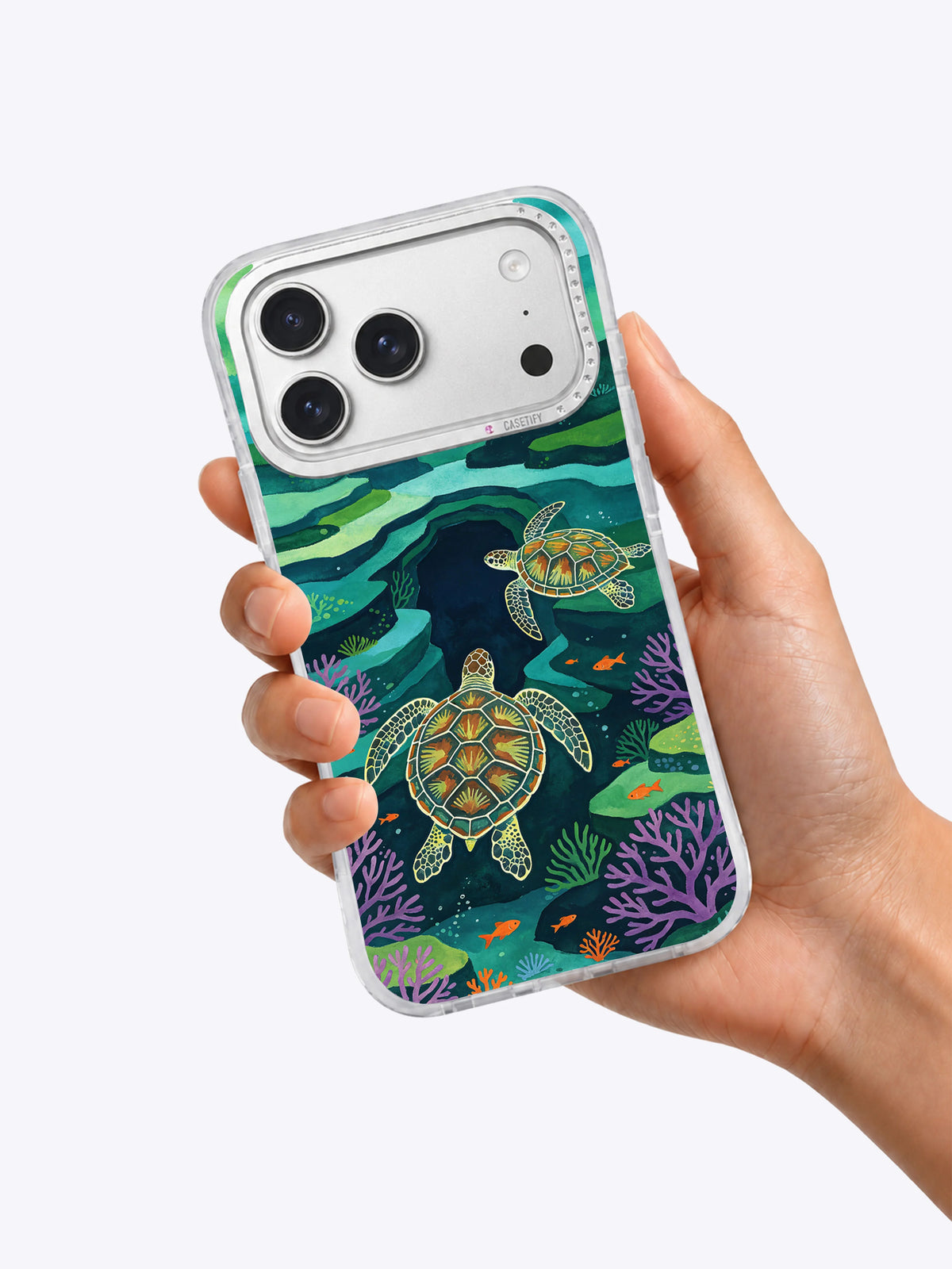Turtle Emerald Bay coastal art iPhone case held in hand