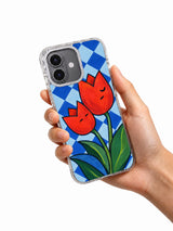 Two Notes of Spring tulip iPhone 17 case held in hand
