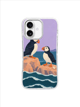 Two puffins finding steady seats on peach shoreline rocks in a flat gouache iPhone 17 case design