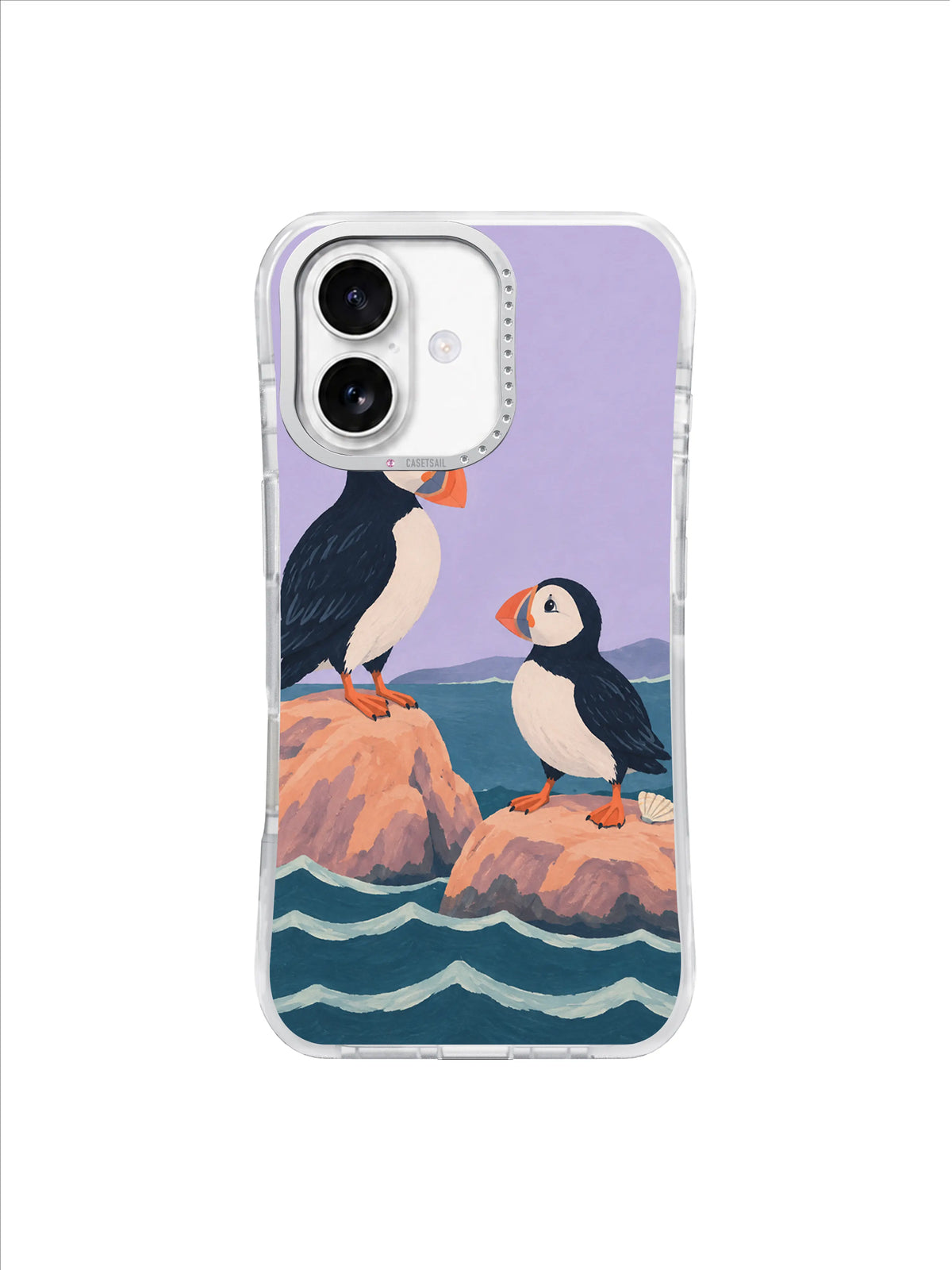 Two puffins perched on separate peach rocks above dark teal tide bands on a lavender iPhone 17 case