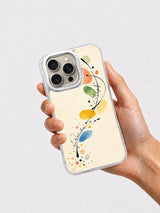 Hand holding pastel painted iPhone 16 Pro case