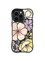 Soft Night Floral Portrait: A large blush flower is framed by cream, lavender and yellow blooms on black.