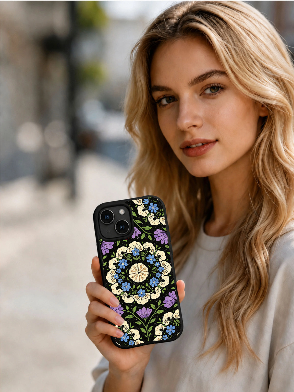 Fossil Dream Night Orchard iPhone 15 Plus case in hand