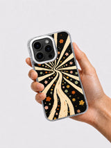 Hand holding the black cream and orange western flower phone case