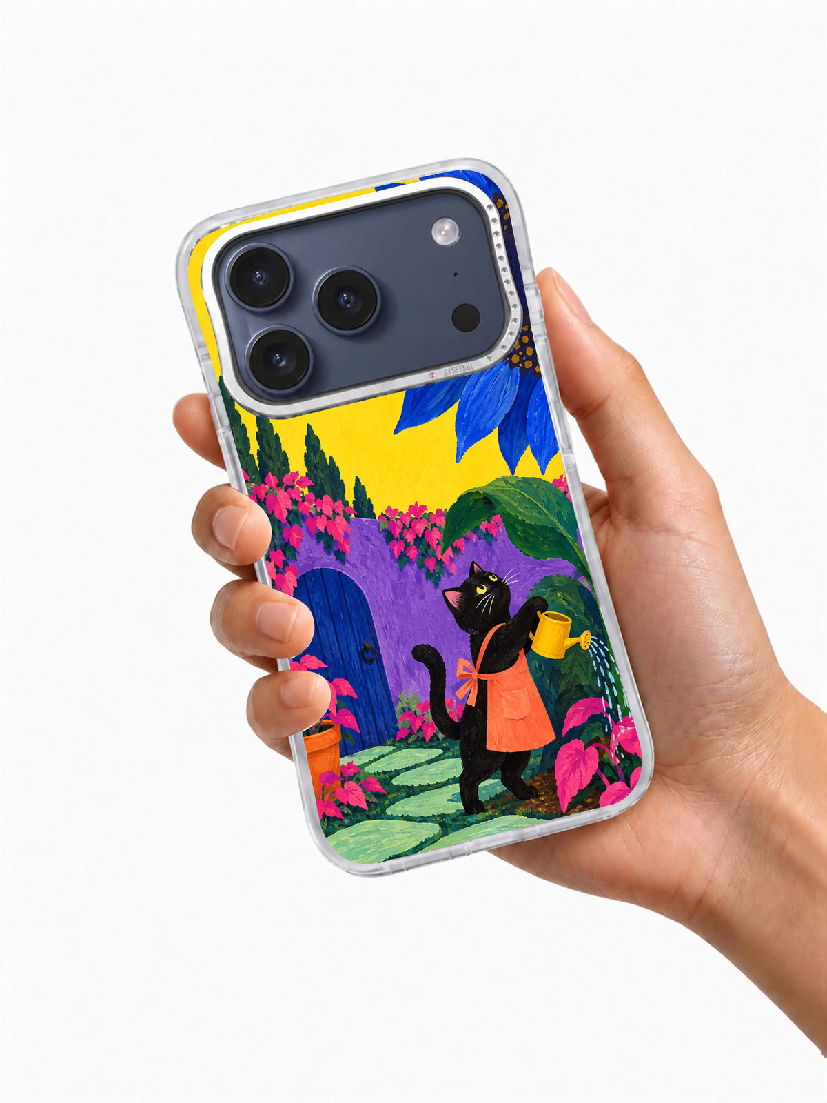 Hand holding a transparent iPhone 17 Pro case with black cat gardener and giant blue sunflower artwork