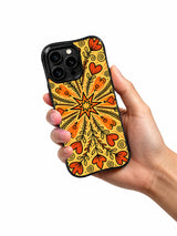 Western Heart Trail floral iPhone 14 Pro case held in hand